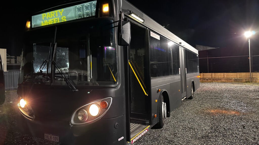 The exterior of Party Charter Perth's Limobus, a 45-seater black party bus.