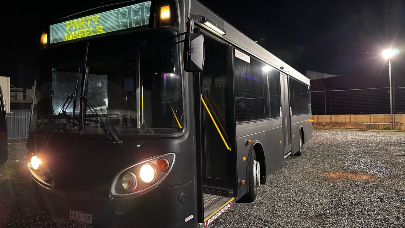 The exterior of Party Charter Perth's Limobus, a 45-seater black party bus.